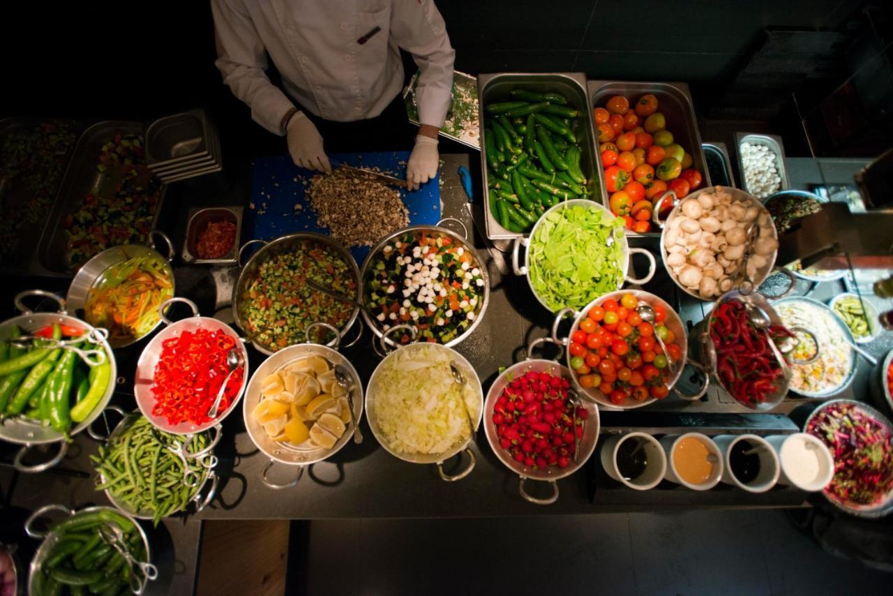 Cramim By Isrotel Exclusive Kiryat Anavim Bagian luar foto A chef preparing ingredients for a meal
